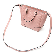 Load image into Gallery viewer, Pink crossbody tote bag Gold-tone hardware featuring Gucci charm 100% leather in GG Microguccissima pattern Linen interior lining Top zip closure Detachable and adjustable shoulder strap 2 slip pouches, 1 zipped pocket Leather tassel detail 8.5&quot; x 11.5&quot; x 4.5&quot;  Strap Drop 19-21 Handle drop 3.5&quot; Product number 449241 Made in Italy 