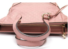 Load image into Gallery viewer, This Gucci GG Logo Microguccissima pink handbag is so cute and perfect for everyday. In a versitile design that effortlessly transitions from handbag to shoulder bag, this accessory can follow you in any situation! The interior is lined in soft, durable linen and includes 2 slip pockets and 1 zipped pocket to keep you organized all day long. Complete with a cute Gucci charm and leather tassel, this bag has all the class you need to style any outfit!