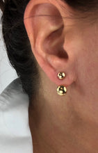 Load image into Gallery viewer, 100% 14K Yellow Gold ball earrings with adjustable ear jacket.  Create a double layered look with adjustable ear jacket to fit any size ear lobe.  Dual polished gold balls hang elegantly as a stud and just under your ear, connected in the back for an invisible drop 