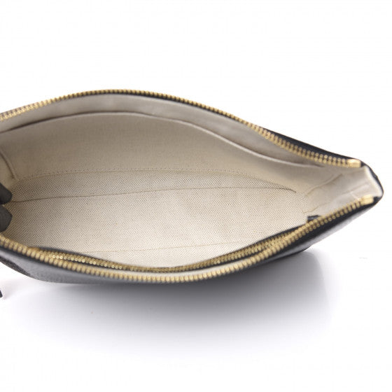 The Gucci Calfskin GG Marmont Pouch in Black is crafted of lovely textured calfskin leather in black. This bag features a top zipper that opens to a beige fabric interior with a zipper pocket and card slots on one side and a single pouch pocket on the opposite.