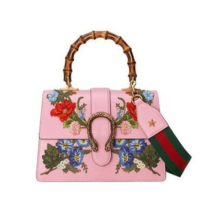 Pink Dionysus Small Embroidered Floral Satchel Bag Gold-tone hardware 100% calfskin leather  Bamboo handle Canvas interior lining  Top flap with pin, slide release closure  Dual tiger head detail  Embroider flower accents  Shoulder strap in signature green and red web  2 interior compartments, 2 slip pockets, 1 zip pocket  7" x 10.5" x 5" Product number 448075 Made in Italy 