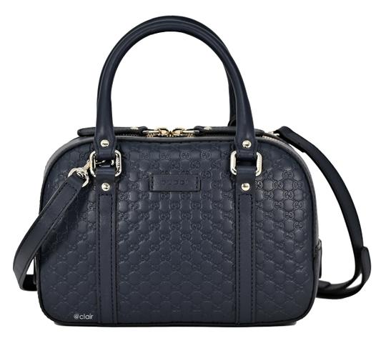 This bag is where functionality and high fashion meet in a beautiful mix! This small crossbody satchel is the perfect size to fit all your day to day needs, while still maintaining the luxury associated with the infamous Gucci brand. There are hand straps as well as a shoulder strap for comfort and inner pockets for prime organization. This navy bag will fit in with your wardrobe perfectly!