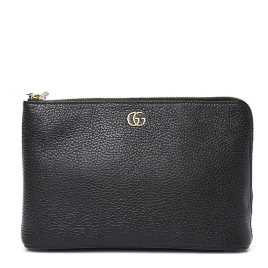 The Gucci Calfskin GG Marmont Pouch in Black is crafted of lovely textured calfskin leather in black. This bag features a top zipper that opens to a beige fabric interior with a zipper pocket and card slots on one side and a single pouch pocket on the opposite.