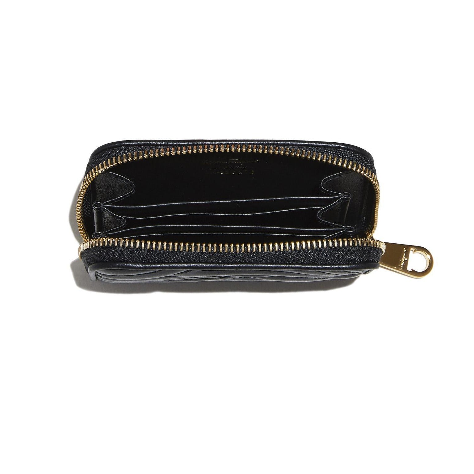 Salvatore Ferragamo Leather Change Purse Black zip closure with two interior pockets and two credit card slots five inches wide by three and one quarter inches height and one inch deep
