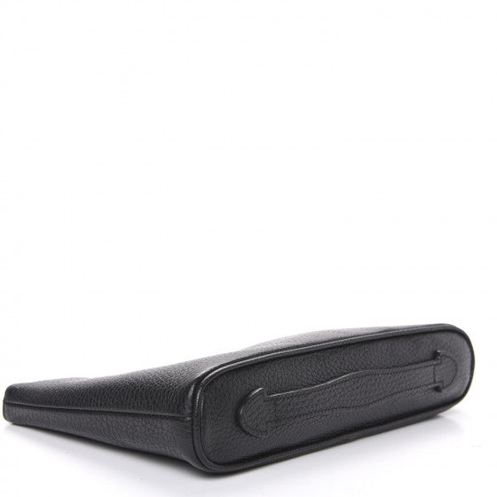 The Gucci Calfskin GG Marmont Pouch in Black is crafted of lovely textured calfskin leather in black. This bag features a top zipper that opens to a beige fabric interior with a zipper pocket and card slots on one side and a single pouch pocket on the opposite.