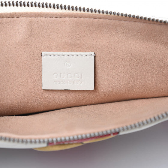 The Gucci Matelasse Trompe L'Oeil Print GG Marmont Pouch in White is crafted of lovely textured calfskin leather in black. This bag features chevron stitching, an aged gold interlocking GG logo and a beige fabric interior. The pattern is designed into woven navy and red stripes with print buckles. The term "trompe l'oeil" is French for a visual illusion in art, especially as used to trick the eye into perceiving a painted detail as a three-dimensional object. 