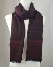 Load image into Gallery viewer, Salvatore Ferragamo Torres Scarf in Black Cherry will keep you soft and warm.  Light enough and just the right size for that added layer as a shawl and double it up around your neck to look stylish in the winter months.  The reds and blacks go with anything in your wardrobe.  Dress it up or wear it with jeans and your favorite T shirt.