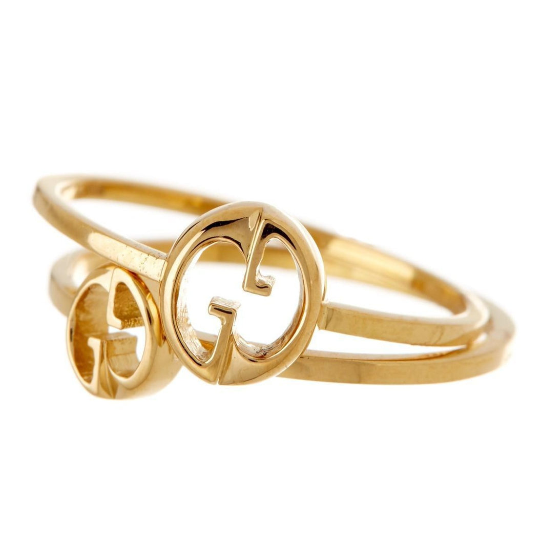  Gucci is not simply limited to bags, and we see their recognizable quality and design in this gorgeous set of rings. Crafted in 18k yellow gold, each of these bands dawn the iconic double G logo carved at the center. A delicate gold chain connects the rings in an elegant and simplistic way to have the stacked look without worrying about one slipping or getting lost! With a high polished finish, this is a dynamic duo that you'll love!\