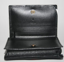 Load image into Gallery viewer, The Gucci GG Marmont Web Quilted Card Case Wallet in Black is a mini snap wallet in quilted black leather. A Double GG logo adorns the front along with a signature Gucci web. The snap closure opens to 4 card slots, a slip pocket, a bill slot with floral linen lining, and a zipped compartment. 