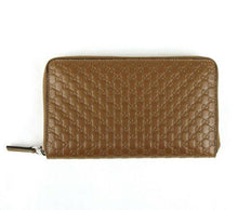 Load image into Gallery viewer, This Gucci Microguccissima Zip-Around wallet is a beautiful piece to add to your luxury goods collection. Features 15 credit card slots, internal flap, a pouch pocket, 2 open bill sections and a zippered money/coin slot. Perfect for organizing all your items in style.