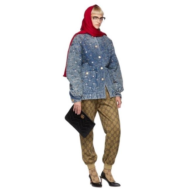The Gucci Marmont Matelesse Velvet Zip Pouch is plush velvet textured with exquisite matelasse stitching enhances the statement-making style of a trim zip-top pouch that can double as a chic clutch. Gilded GG hardware inspired by an archival design adds a signature finishing touch.