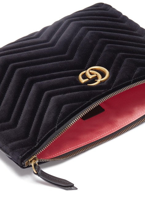 The Gucci Marmont Matelesse Velvet Zip Pouch is plush velvet textured with exquisite matelasse stitching enhances the statement-making style of a trim zip-top pouch that can double as a chic clutch. Gilded GG hardware inspired by an archival design adds a signature finishing touch.
