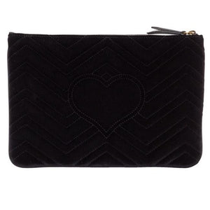 The Gucci Marmont Matelesse Velvet Zip Pouch is plush velvet textured with exquisite matelasse stitching enhances the statement-making style of a trim zip-top pouch that can double as a chic clutch. Gilded GG hardware inspired by an archival design adds a signature finishing touch.
