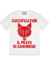 Load image into Gallery viewer, Gucci oversized T shirt in soft white cotten with a red printed fox face and the words &quot;Guccification il prato di ganimede&quot; printed above and below the wolf head.  This t shirt is striking and the print is very large.  The extra small size fits more like a medium sized t shirt would.  This t shirt is considered unisex by us but is part of the women&#39;s collection by Gucci.