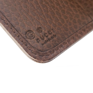 Brown and Beige wallet Signature interlocking GG pattern Light gold-toned hardware GG Supreme canvas lined with leather Zip around closure Money flap secured with snap button 6 credit card slots, 1 zipped coin pouch, 1 bill compartment 4" x 4.25" x 1.25" Product number 346056 Made in Italy