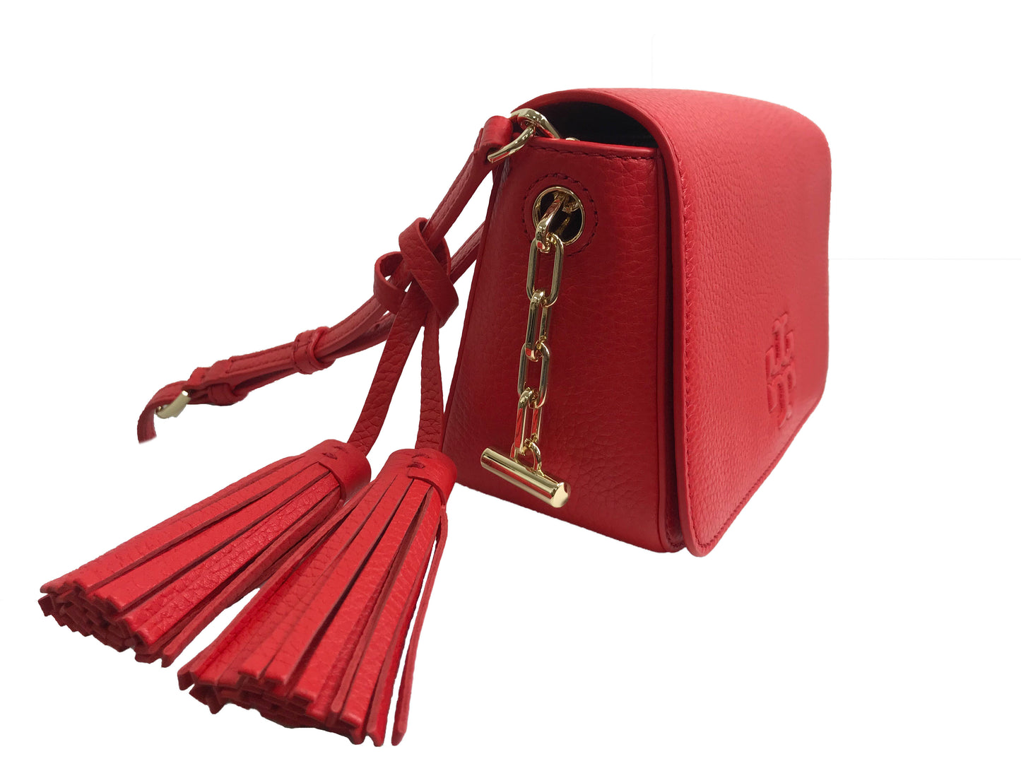 Imported Pebbled leather with removable tassels. Flap top with magnetic snap closure with stitch T-logo detail. Adjustable leather strap for shoulder/crossbody wear, 21" drop and detachable strap as well for use as clutch. Interior: Logo lining; one multifunction slip pocket. Approximate measurements: 8" L x 5-1/2" L x 3-1/4" W.