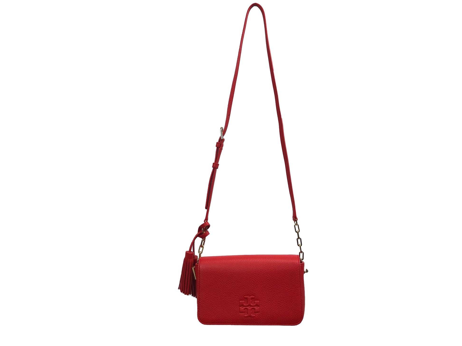 Imported Pebbled leather with removable tassels. Flap top with magnetic snap closure with stitch T-logo detail. Adjustable leather strap for shoulder/crossbody wear, 21" drop and detachable strap as well for use as clutch. Interior: Logo lining; one multifunction slip pocket. Approximate measurements: 8" L x 5-1/2" L x 3-1/4" W.