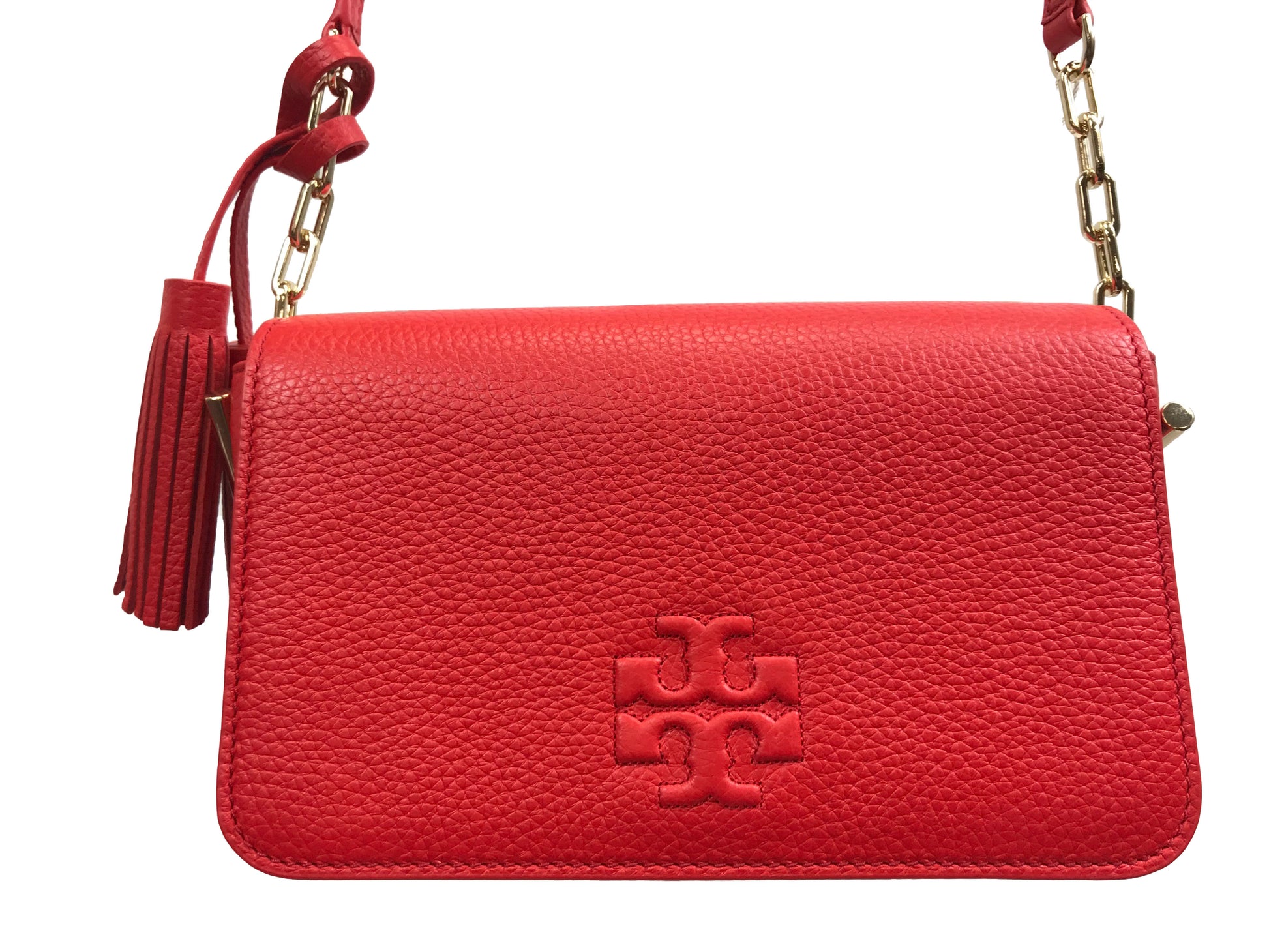 Imported Pebbled leather with removable tassels. Flap top with magnetic snap closure with stitch T-logo detail. Adjustable leather strap for shoulder/crossbody wear, 21" drop and detachable strap as well for use as clutch. Interior: Logo lining; one multifunction slip pocket. Approximate measurements: 8" L x 5-1/2" L x 3-1/4" W.