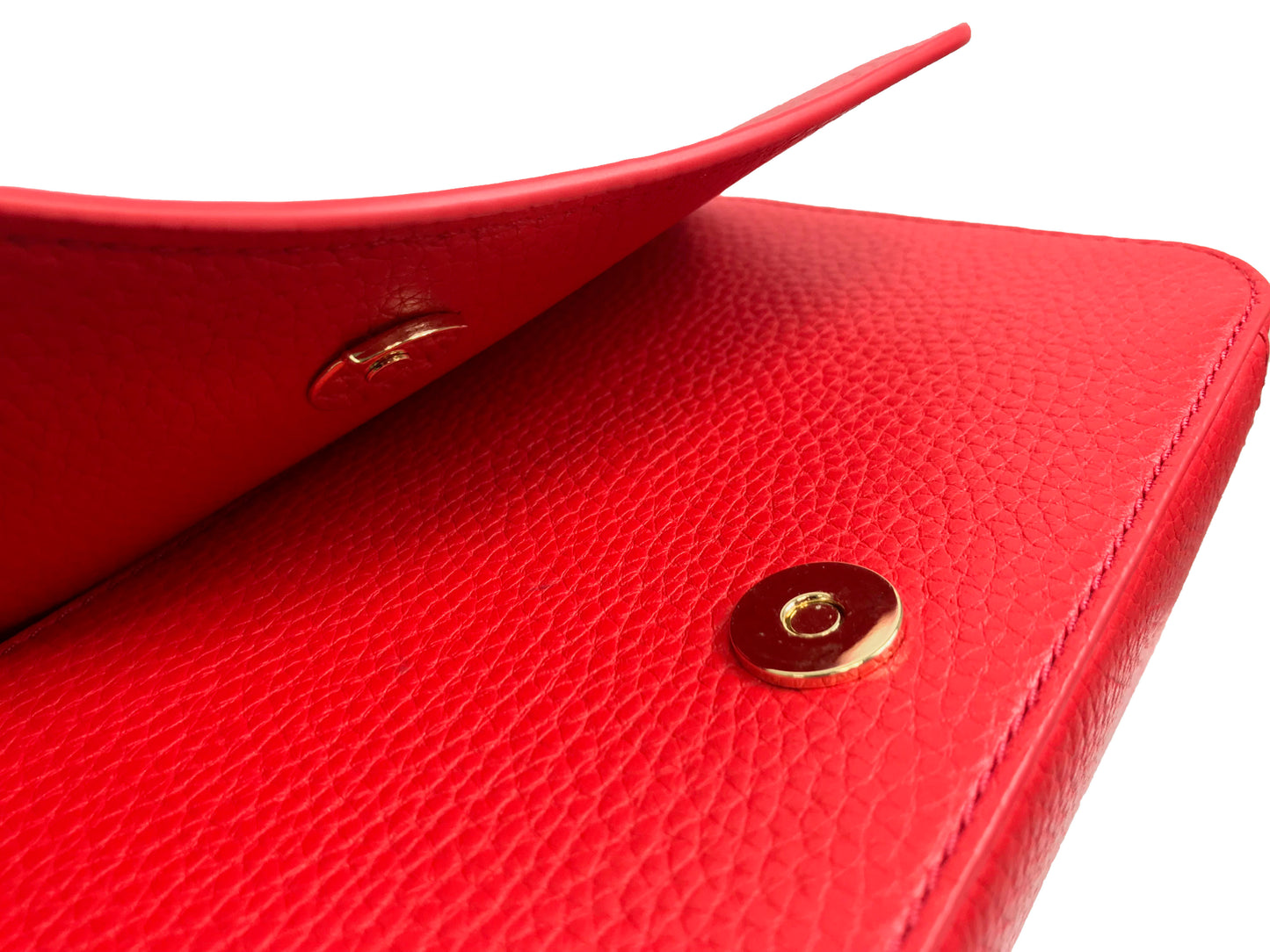 Imported Pebbled leather with removable tassels. Flap top with magnetic snap closure with stitch T-logo detail. Adjustable leather strap for shoulder/crossbody wear, 21" drop and detachable strap as well for use as clutch. Interior: Logo lining; one multifunction slip pocket. Approximate measurements: 8" L x 5-1/2" L x 3-1/4" W.