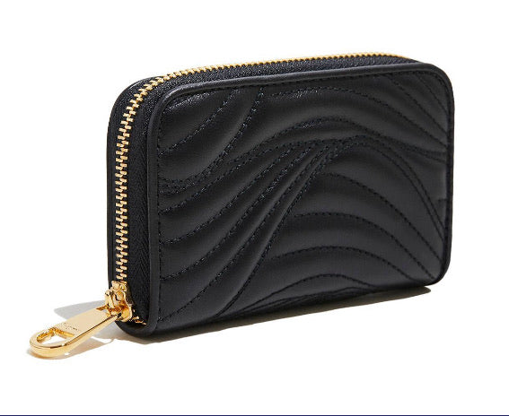 Black coin purse with embossed "wave" quilting pattern Gold-toned hardware Zip around top  3 interior compartments and 2 card slots Comes with Red Salvatore Ferragamo Box 5" x 3.25" x 1"  Made in Italy