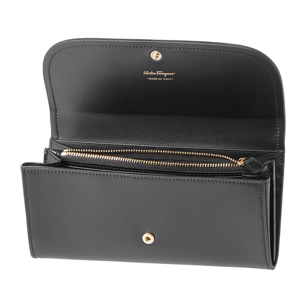 This wallet has 2 main compartments for bills, 10 card holders, and a zipper pouch for coins. Function and style? This Ferragamo wallet has everything you need, complete with a little bow on top! 