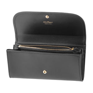 This wallet has 2 main compartments for bills, 10 card holders, and a zipper pouch for coins. Function and style? This Ferragamo wallet has everything you need, complete with a little bow on top! 