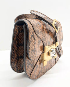 Python snake skin shoulder bag Gold-toned hardware Beige interior 100% python snakeskin leather Embossed leather interior with GG design Push-lock enameled tiger closure with Swarovski red eyes Structured silhouette and flat base for stability Spacious interior 7.5" x 6.5" x 2" Strap 20" drop Comes in Gucci dust bag with care booklet and controllatto card Product number 500781 Made in Italy