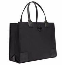 Load image into Gallery viewer, An everyday bag needs to have style and function, and the Tory Burch Ella tote delivers just that! Made with durable nylon and lined with high quality leather, this tote back is reliable in any situation. In classic black, this bag features a top snap closure, interior zipped pocket, and 2 slip pouches to safely carry all your belongings. 